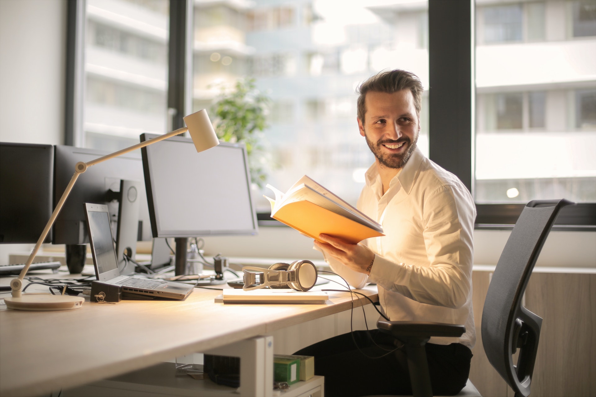 guy with book in office